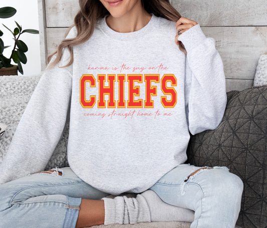 Karma is the guy on the Chiefs Crewneck